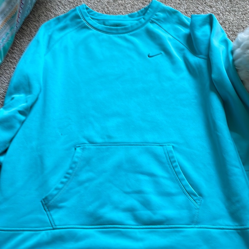 Well loved Nike sweatshirt. Light teal in color. Size xl